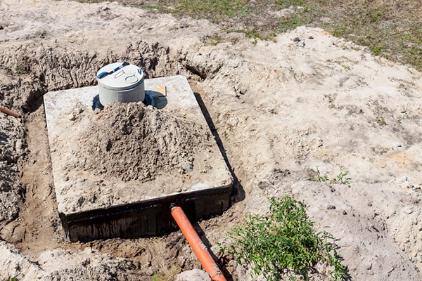 signs that your septic tank needs pumping include slow drains, gurgling noises, and sewage odors, indicating it's time for septic tank pumping